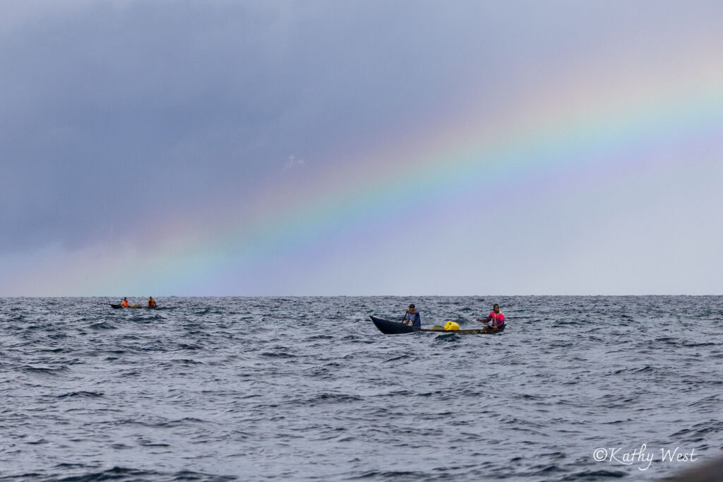 Rainbow and dugout canoes in a rainbow, Antongil Bay, Madagascar